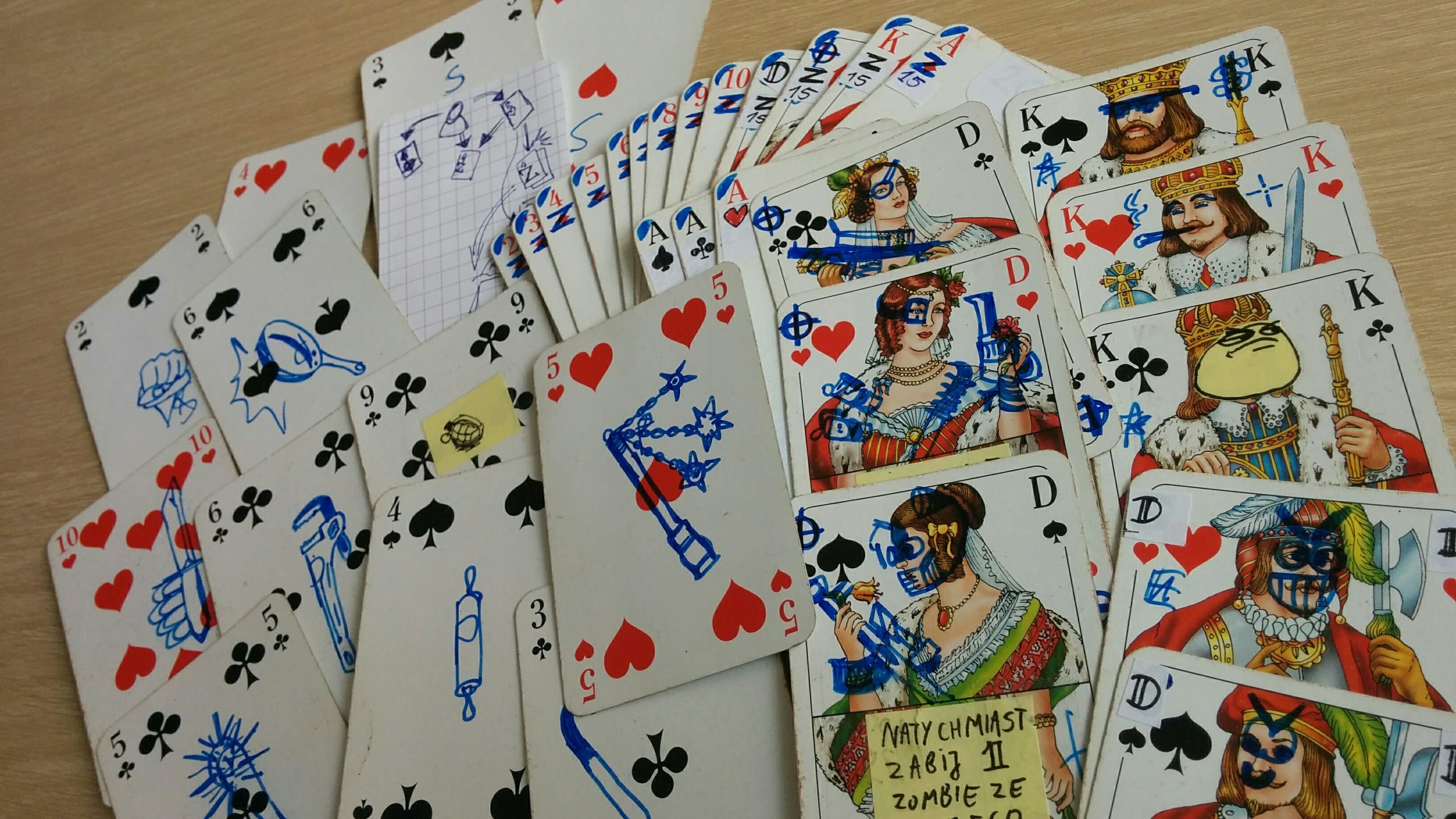 Basic playing cards with extra pen drawings on them